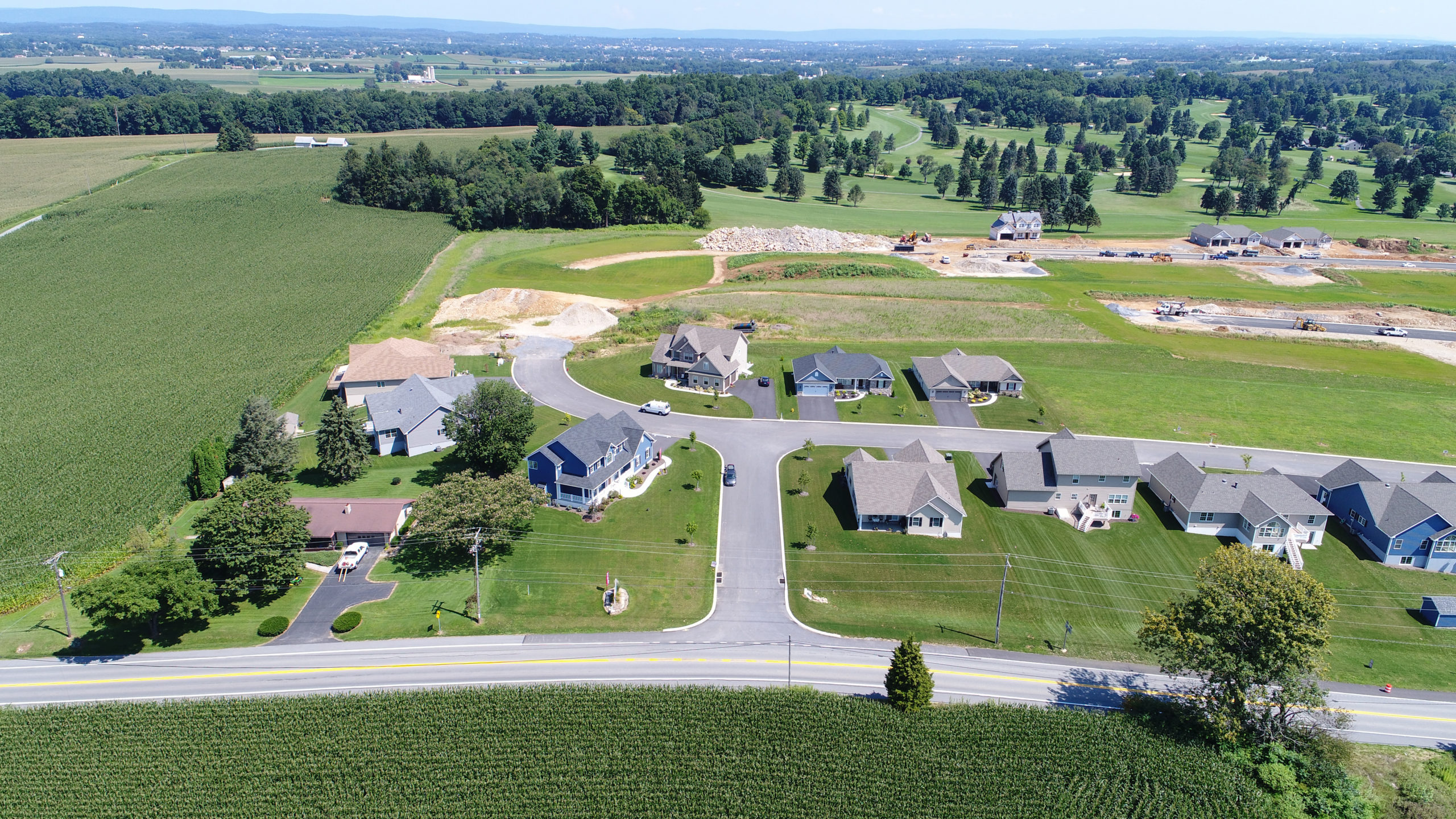 Aerial photo of Scenic Ridge at Cornwall showing roads, houses, surrounding fields and trees