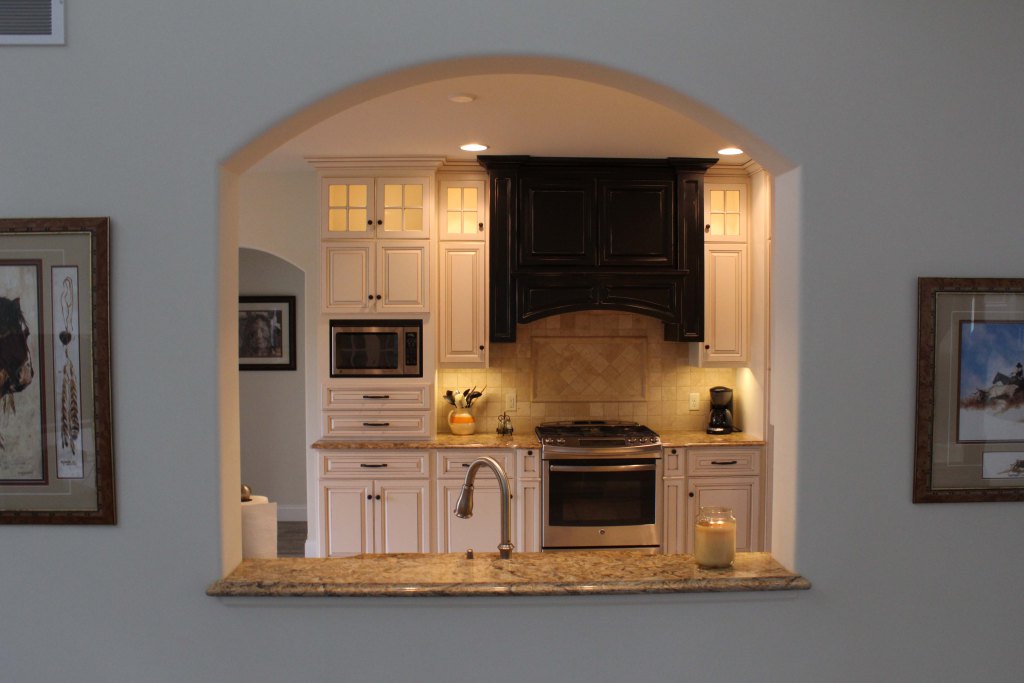 See-through arched opening into kitchen