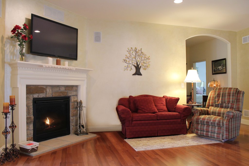Cozy fireplace in a room with hardwood floor