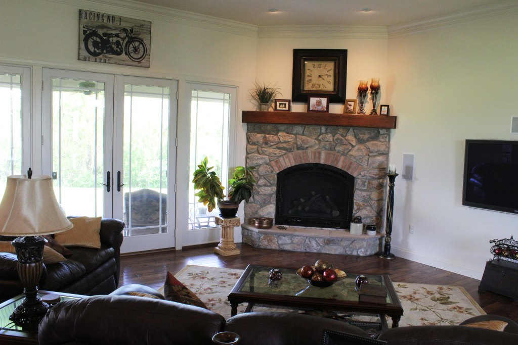 Stone fireplace by French doors